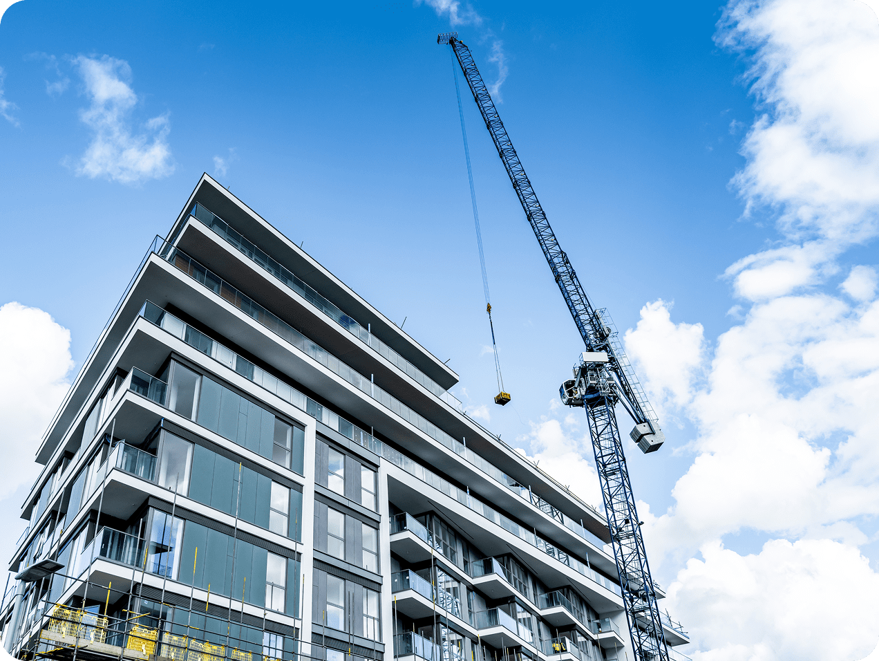 Building under construction with a crane.